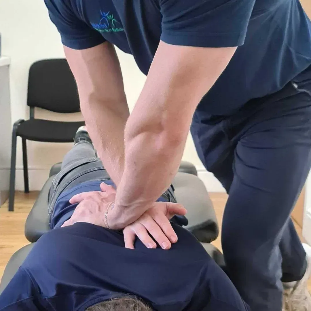 Hands-on adjustment on a treatment table